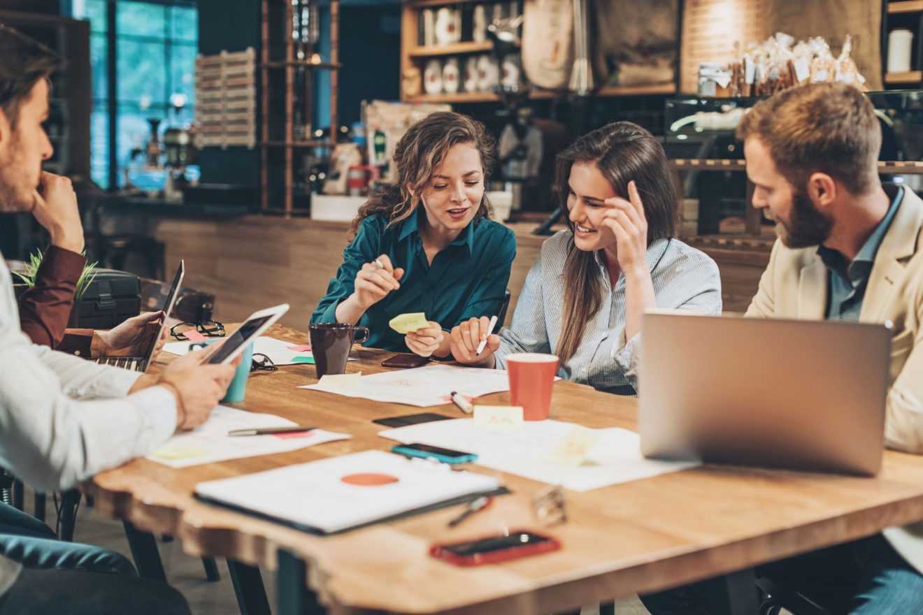 A group of people meets at a coffee shop
