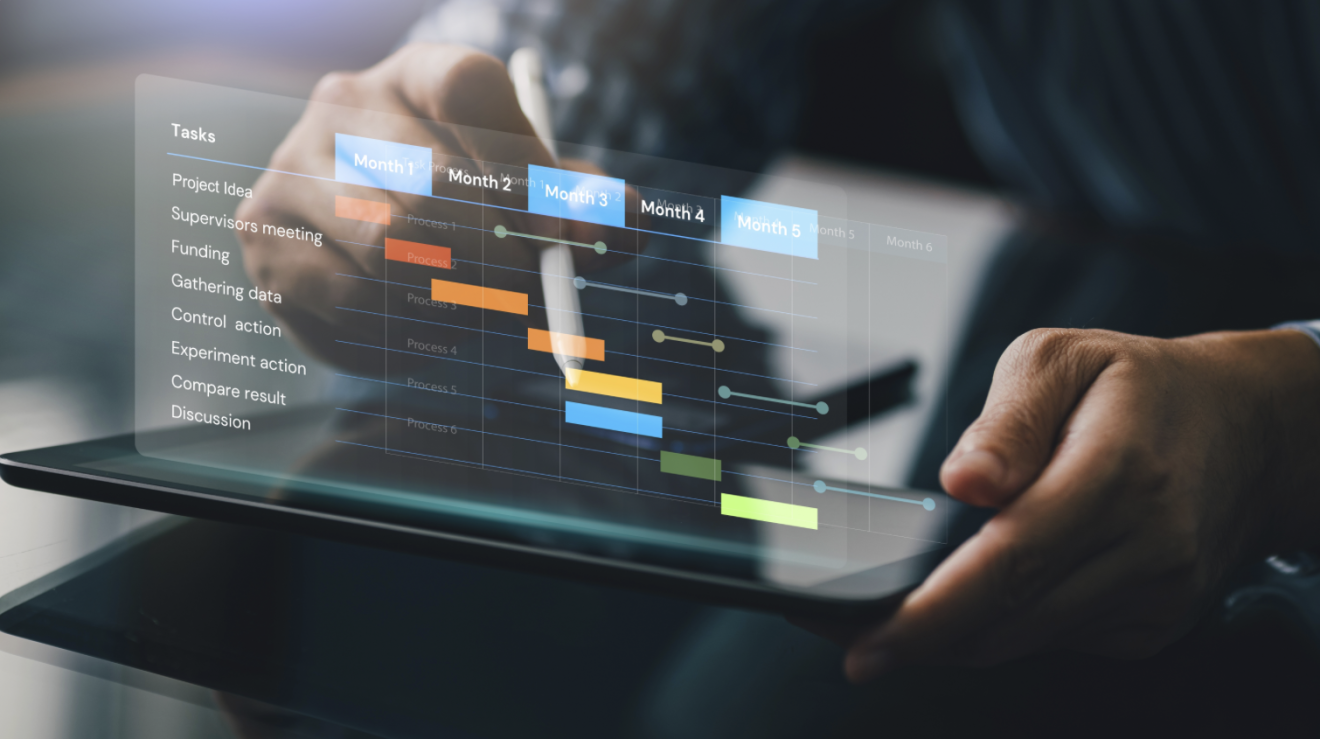 A person uses a digital project tracker on a tablet