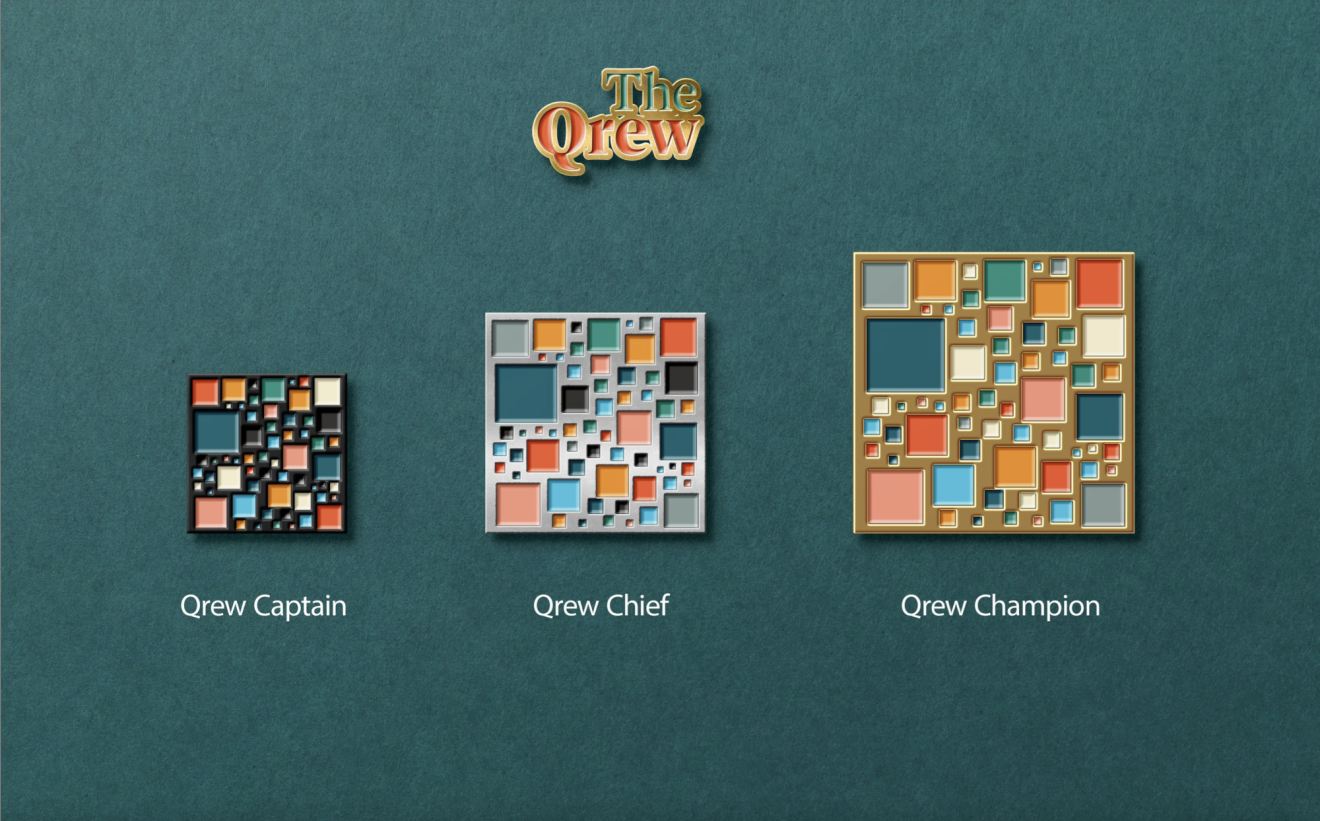 The enamel pins associated with each Qrew Champion rank — Captain, Chief, and Champion